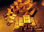 stacks of gold bullion bars and coins