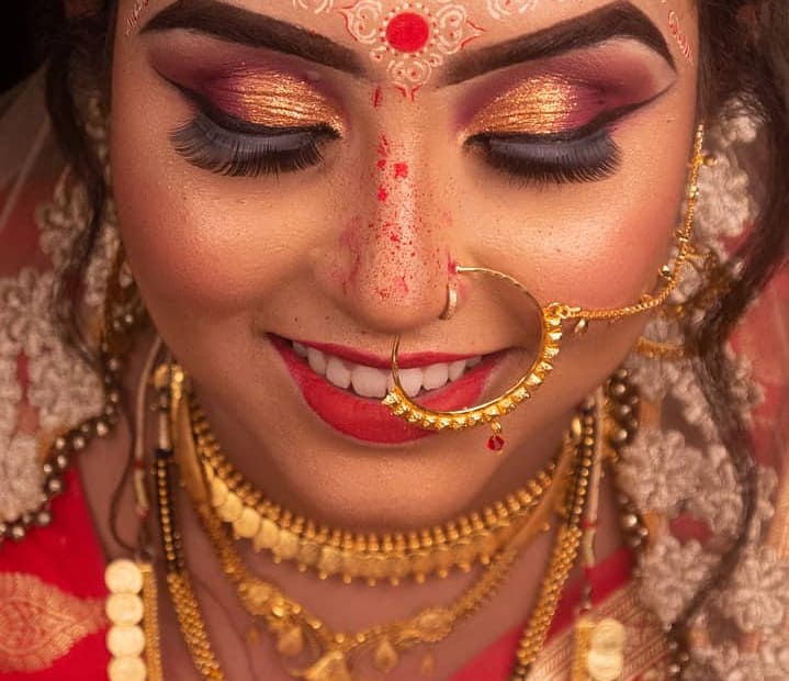 Indian woman wearing gold jewelry